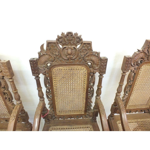 1150 - A set of eight Malaysian Colonial (Malaccan) carved hardwood dining chairs in mock Jacobean style wi... 