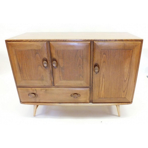 1160 - A retro Ercol elm sideboard with three cupboards and a drawer, cutlery drawer within