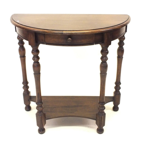 1168 - An oak demi-lune hall table with single drawer and turned supports