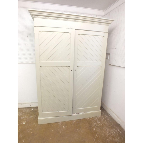 1197 - An Edwardian painted pitch pine wardrobe with diagonal panelling and fitted interior