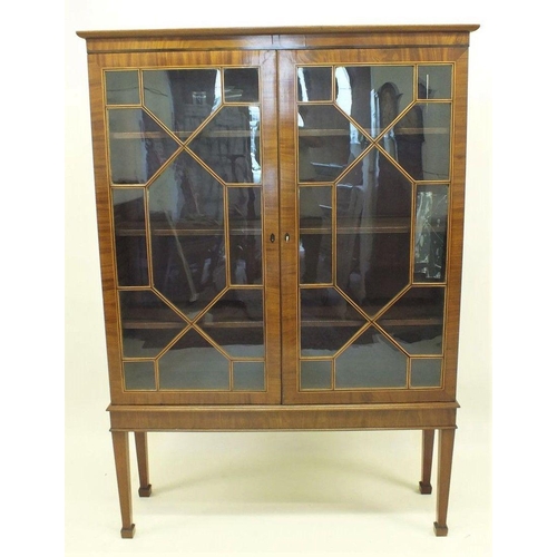 1209 - A large Georgian style two door mahogany and satinwood strung astragal glazed display cabinet, with ... 