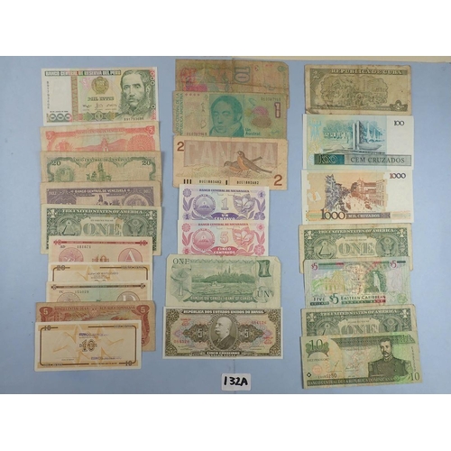 132A - A wad of North & South America banknotes. Examples including: Argentina, Canada, Cuba, Brazil, Easte... 