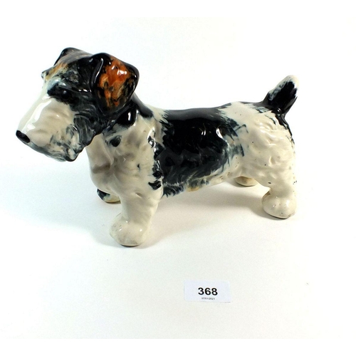 368 - A pottery dog door stop, one eye missing 26cm long