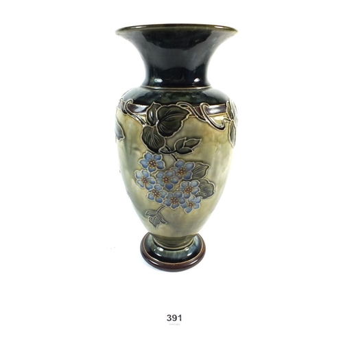 391 - A Royal Doulton stoneware vase decorated with flowers, 27cm