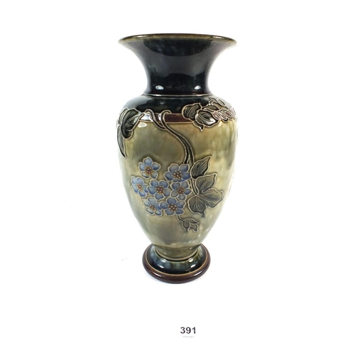 391 - A Royal Doulton stoneware vase decorated with flowers, 27cm