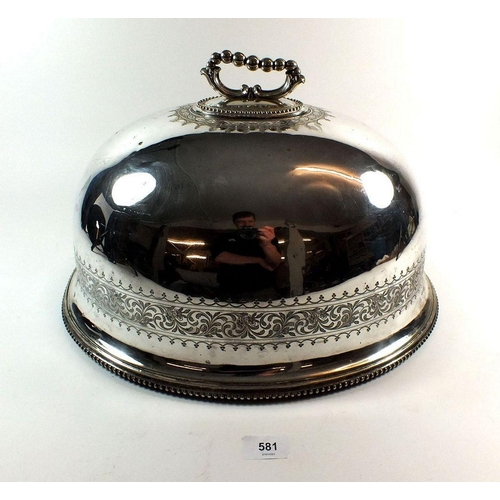 581 - A large oval silver plated meat cover with engraved decoration, 18 x 15 x 12cm