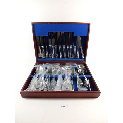 583 - A stainless steel cutlery set in fitted case