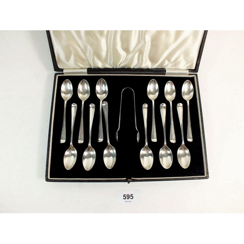 595 - A set of twelve silver coffee spoons and tongs, cased, Sheffield 1933 - 117g