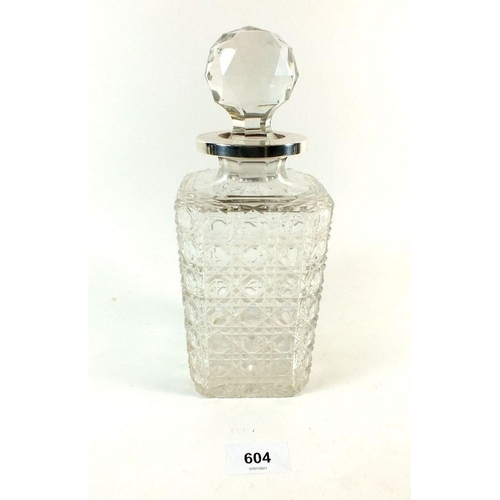 604 - An Edwardian Elkington and Co. cut glass single decanter of square form with silver collar  Birmingh... 