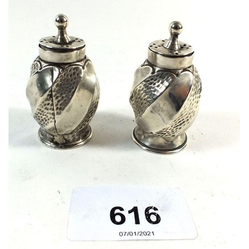 616 - A pair of silver spiral embossed pepper pots, Birmingham 1890 by Cornelius D Saunders and JF Holling... 