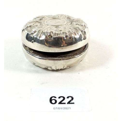 622 - A sterling silver covered yo yo with embossed decoration by L S M, 5.5 cm diameter