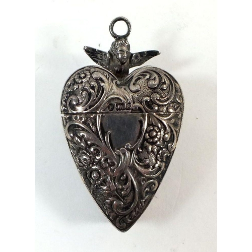 623A - A silver heart form pendant or chatelaine box with embossed decoration, import mark for London 1902,... 