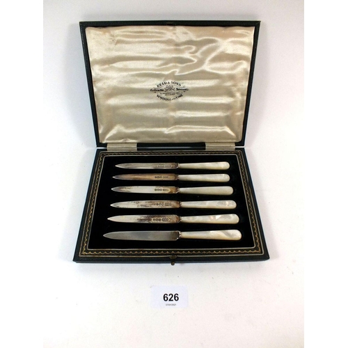 626 - A set of six silver and mother of pearl fruit knives cased, Sheffield 1925