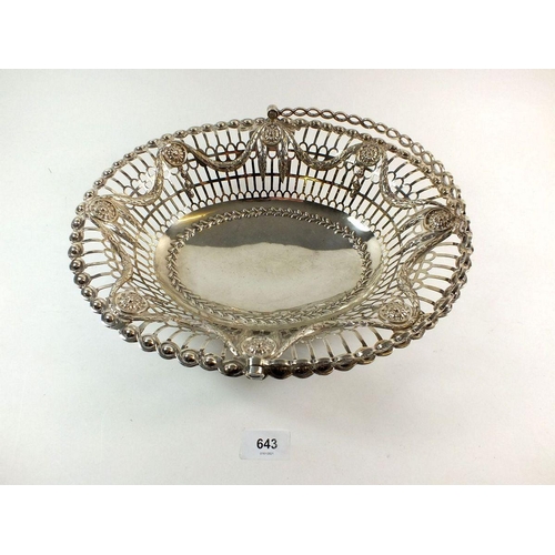 643 - A large silver cake basket with embossed swag decoration, London 1773, by Richard Mills, 675g