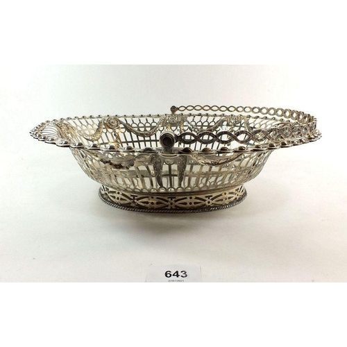 643 - A large silver cake basket with embossed swag decoration, London 1773, by Richard Mills, 675g