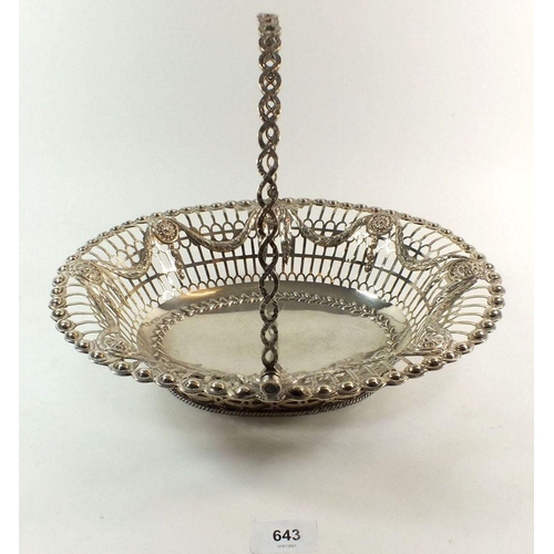 643 - A large silver cake basket with embossed swag decoration, London 1773, by Richard Mills, 675g