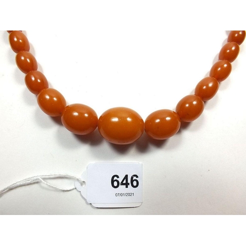 646 - A golden amber bead necklace, 47g