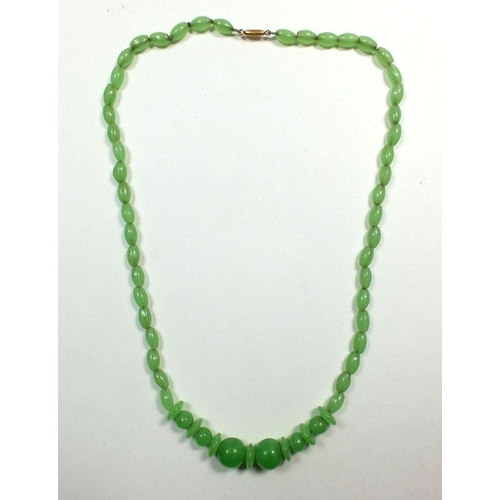 648 - A carved jade bead necklace