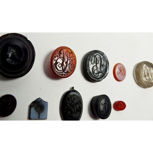 654 - A group of early 19th century carved stone intaglios etc