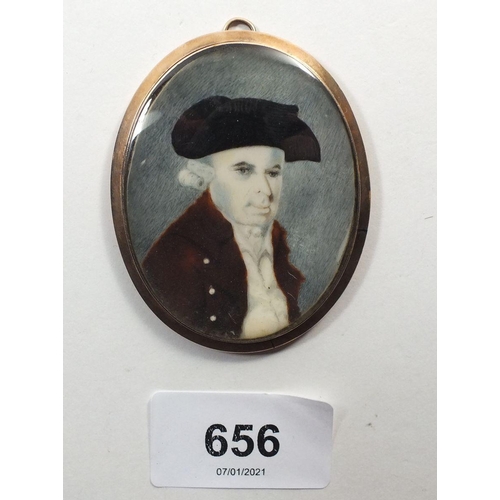 656 - An early 19th century watercolour on ivory miniature portrait of a man in oval 18ct gold frame with ... 