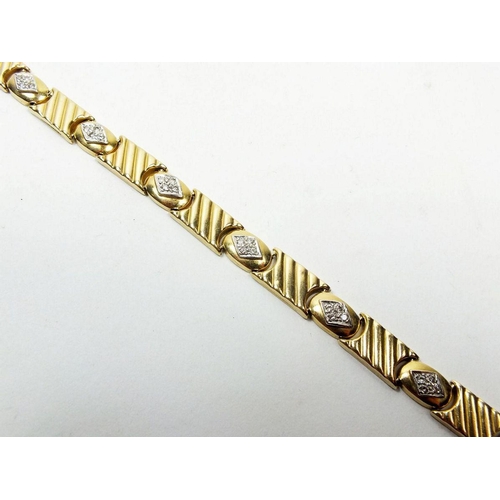 668 - An 18 carat gold link and diamond set bracelet, 20cm long, 18.8g