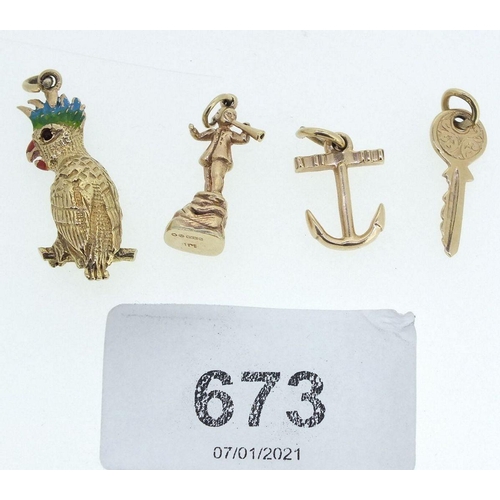 673 - Four 9 carat gold charms comprising parrot, key, anchor and boy with horn 9.4g