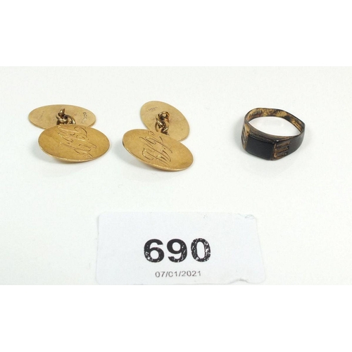 690 - A pair of 9ct gold cufflinks, 7.8g and a 9ct gold ring inset black onyx, size L