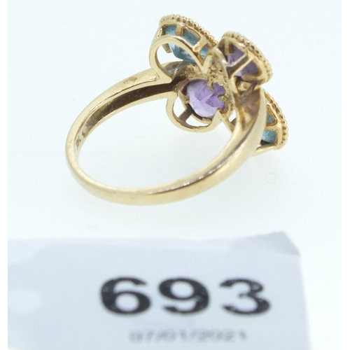 693 - A 14ct gold ring set blue topaz and amethyst - size M-N