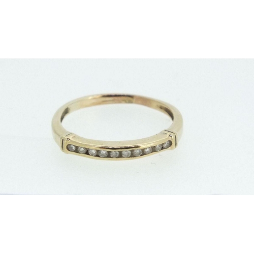 696 - A gold ring set line of small diamonds, size M -   1.4g, not marked but tested as gold