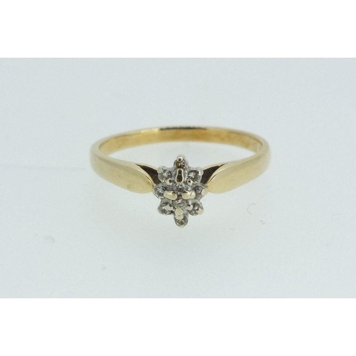 698 - A 14ct gold and diamond cluster ring, size M - 2.2g