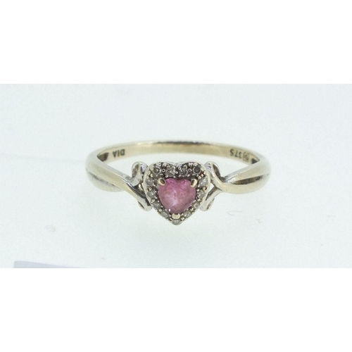 699 - A 9ct gold ring with amethyst heart form stone within chip diamond surround, Size L -1.5g