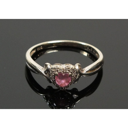 699 - A 9ct gold ring with amethyst heart form stone within chip diamond surround, Size L -1.5g