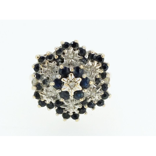 707 - A 9ct gold sapphire and diamond cluster ring - size N