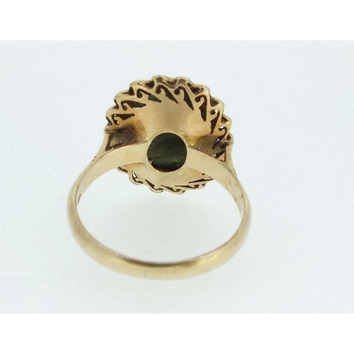 710 - A 14ct gold ring set green stone, size O