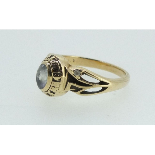 715 - An early to mid 20thC 10ct gold and paste ring with embossed name around stone for 'Nelson McIntyre'... 