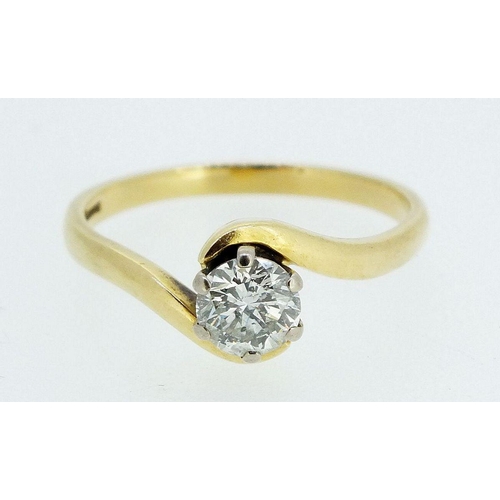 725 - An 18 carat gold crossover set solitaire diamond ring, (approx 60/70 pts), size O to P