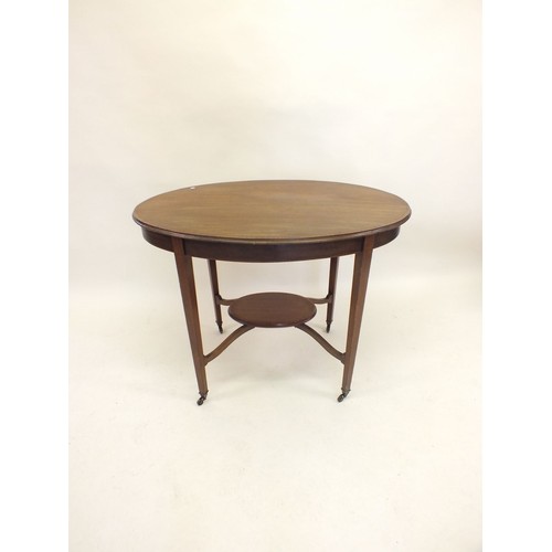 1137 - An Edwardian mahogany oval occasional table with crossbanding and undertier