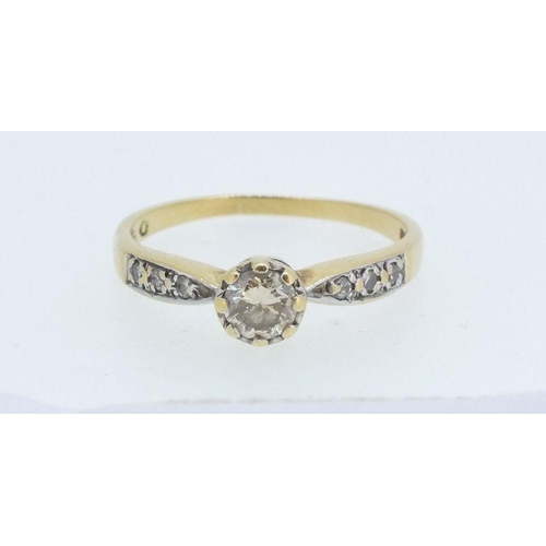 225 - An 18ct gold and platinum set diamond ring, the central stone 1/2ct on diamond set shoulders, size O... 