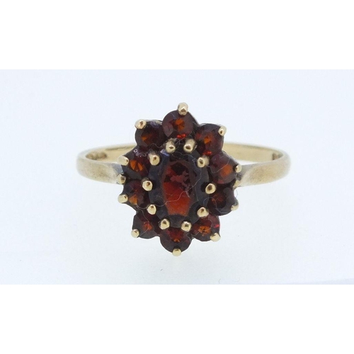 227 - A 9ct gold cluster ring set garnets, size O, 2g