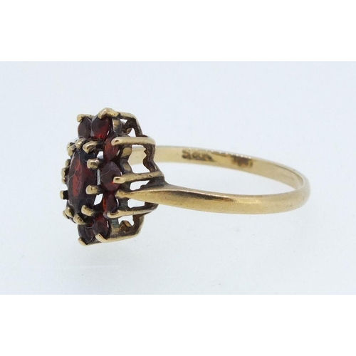 227 - A 9ct gold cluster ring set garnets, size O, 2g