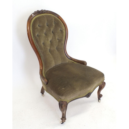 1236 - A Victorian mahogany button upholstered chair with floral carved frame