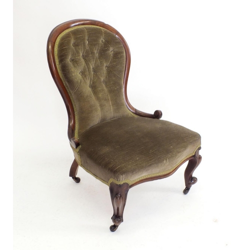 1237 - A Victorian mahogany button upholstered chair on scroll supports