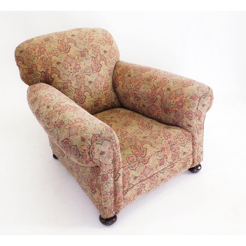 1238 - A Victorian tapestry upholstered club armchair on bun feet