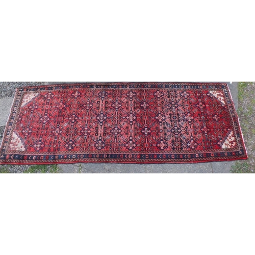 1239A - A full pile wool washed red ground Persian runner with all over design - 323 x 113cm