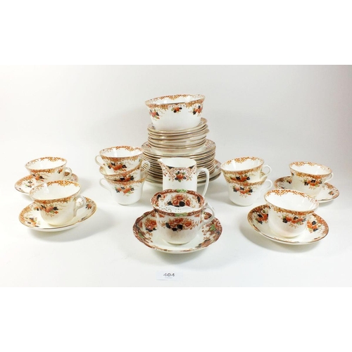 404 - A Gladstone China tea service comprising: nine cups and saucers, twelve tea plates, two cake plates,... 