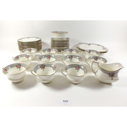 440 - An Aynsley tea service with rose and black scale borders comprising: eleven cups and saucers, two ca... 