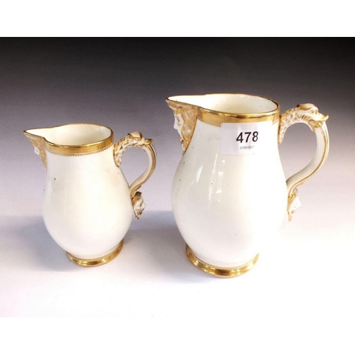 478 - Two early 19th century gilt and white mask jugs, 14cm tall