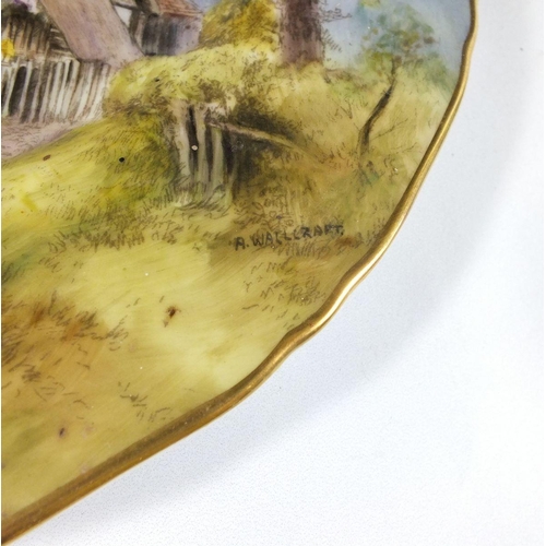 484 - A Royal Worcester plate painted 'Thatched Cottage at Wick' signed A Wallcraft, 27cm diameter