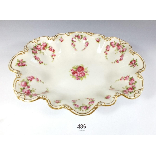 486 - A Crescent China frilled bowl painted roses, 27cm wide