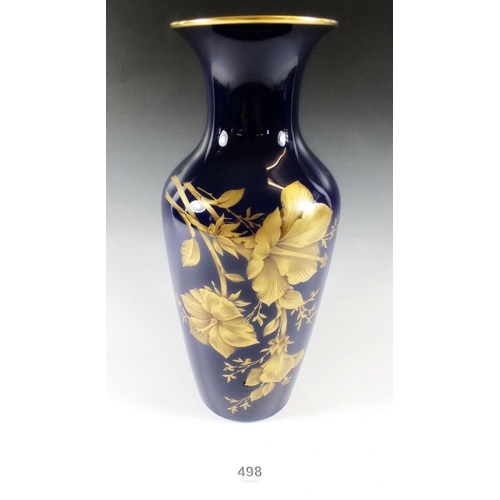 498 - A Kaiser cobalt blue and gilt vase decorated flowers, 26cm